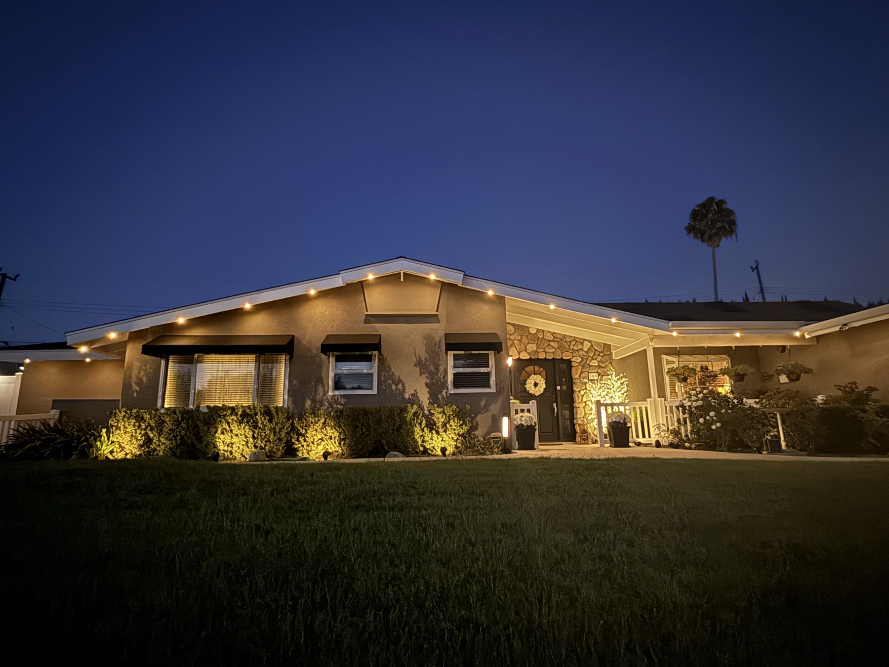 Ranch home, stone entry and warm eaves